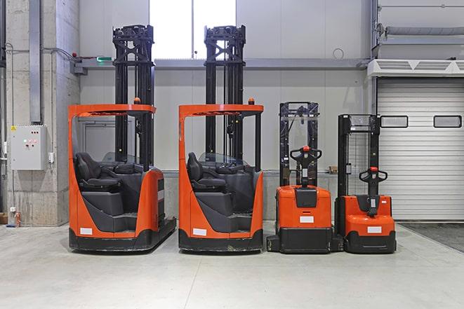 forklifts maneuvering in a manufacturing plant